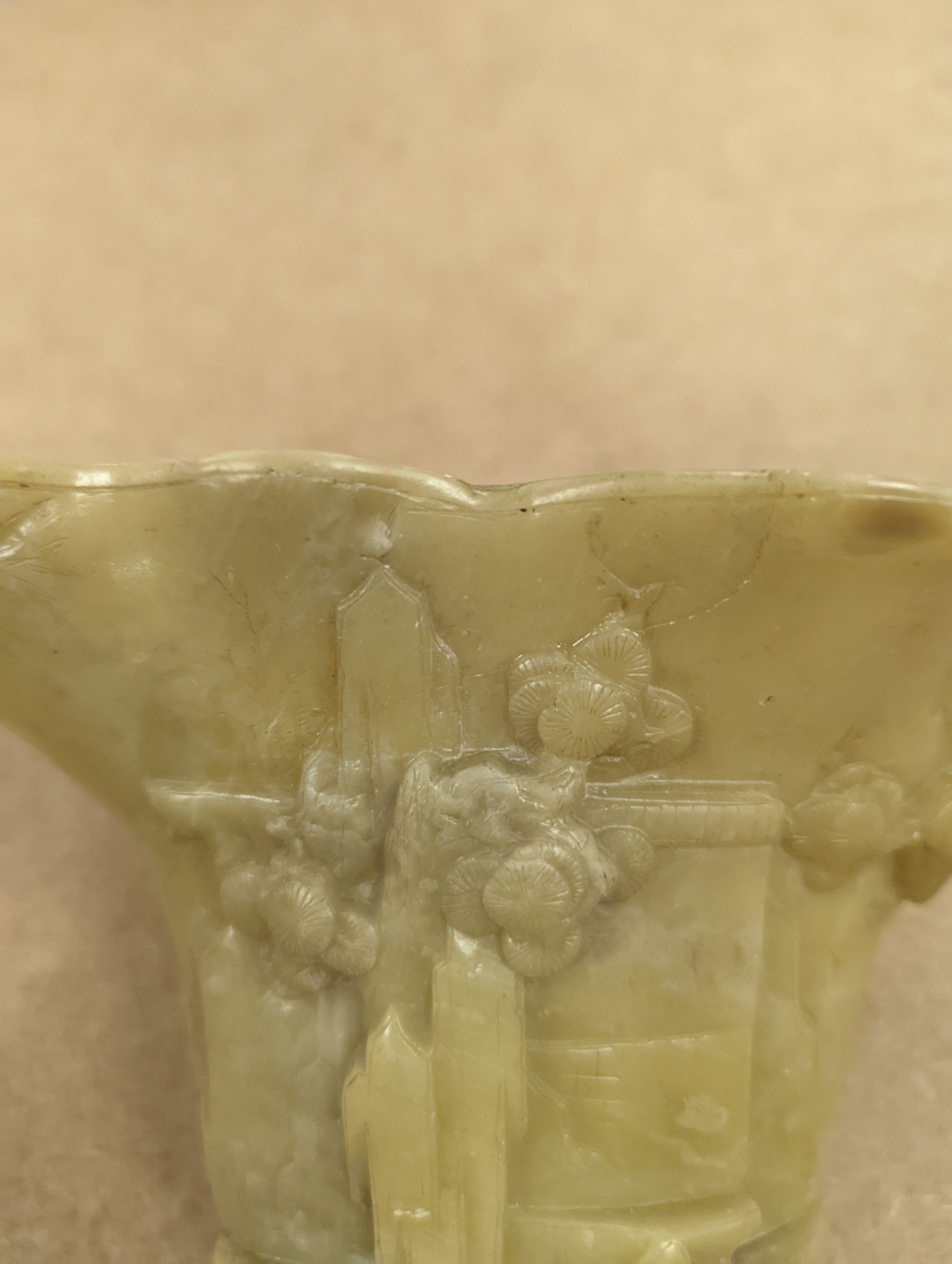 A Chinese carved soapstone libation cup, 19cm